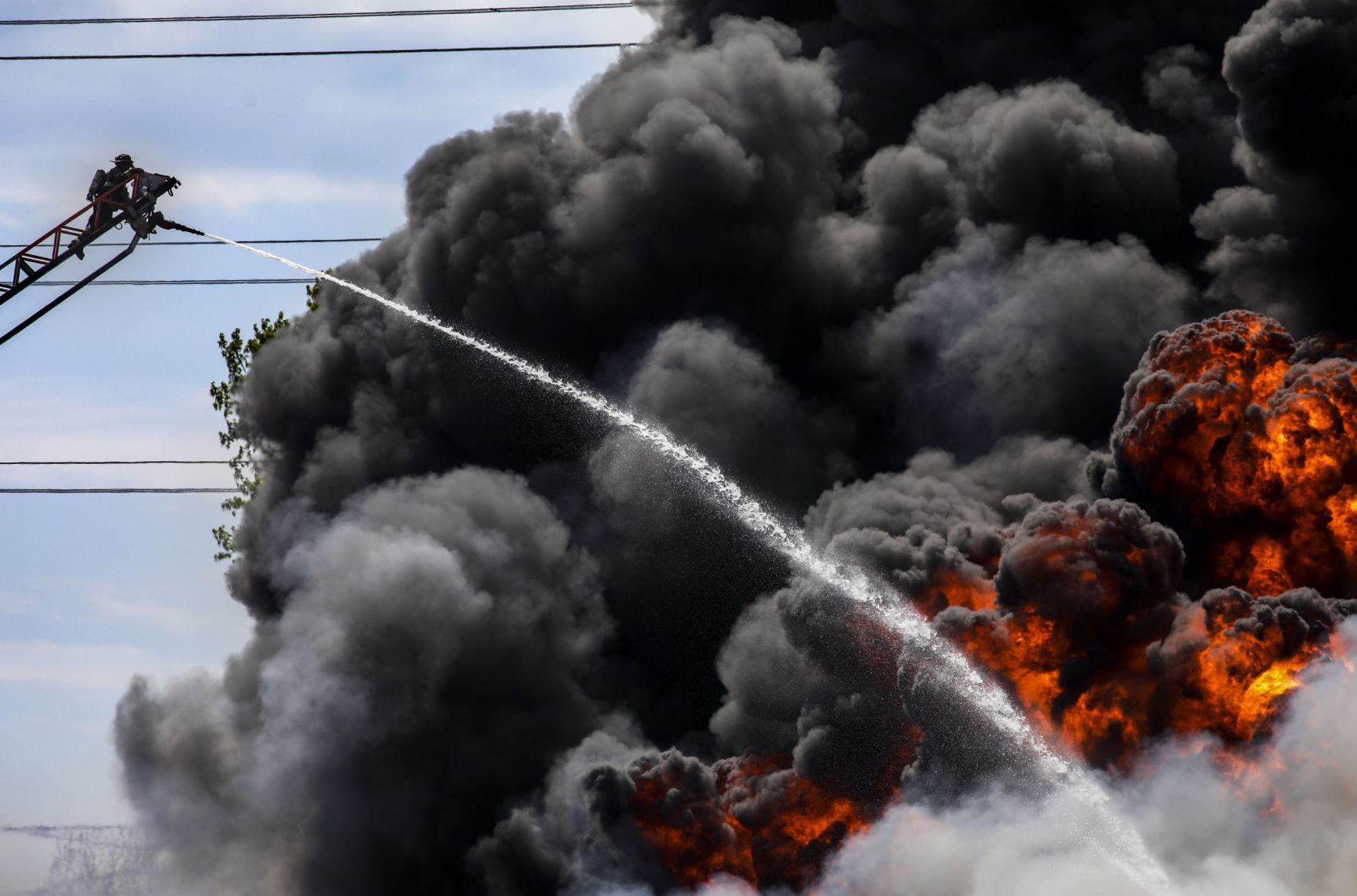 Large fire rolls through warehouse